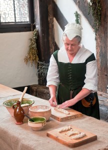 Tudor Gentlewoman Alison Nicholls prepares a Lammas loaf at Little Moreton Hall C Emma Williams/National Trust