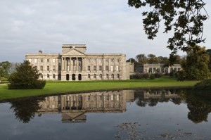 The south front of Lyme Park, Cheshire, seen across the lake, in autumn