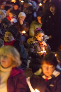 Visitors gather to sing carols in the evening at Fountains Abbey.