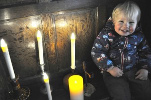 A young visitor looks forward to Candlemas at Little Moreton Hall C Alan Ingram/ National Trust